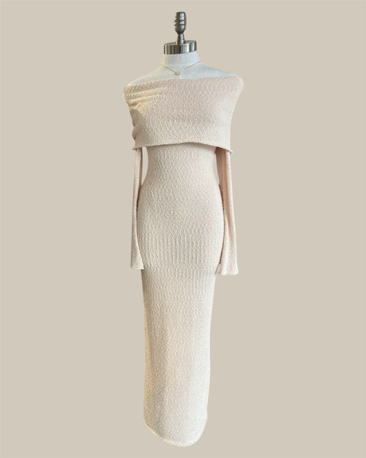 White dress on a mannequin against a beige background