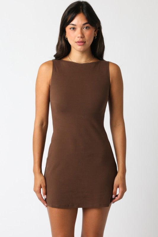 Model wearing sleeveless chocolate brown mini dress with high neckline